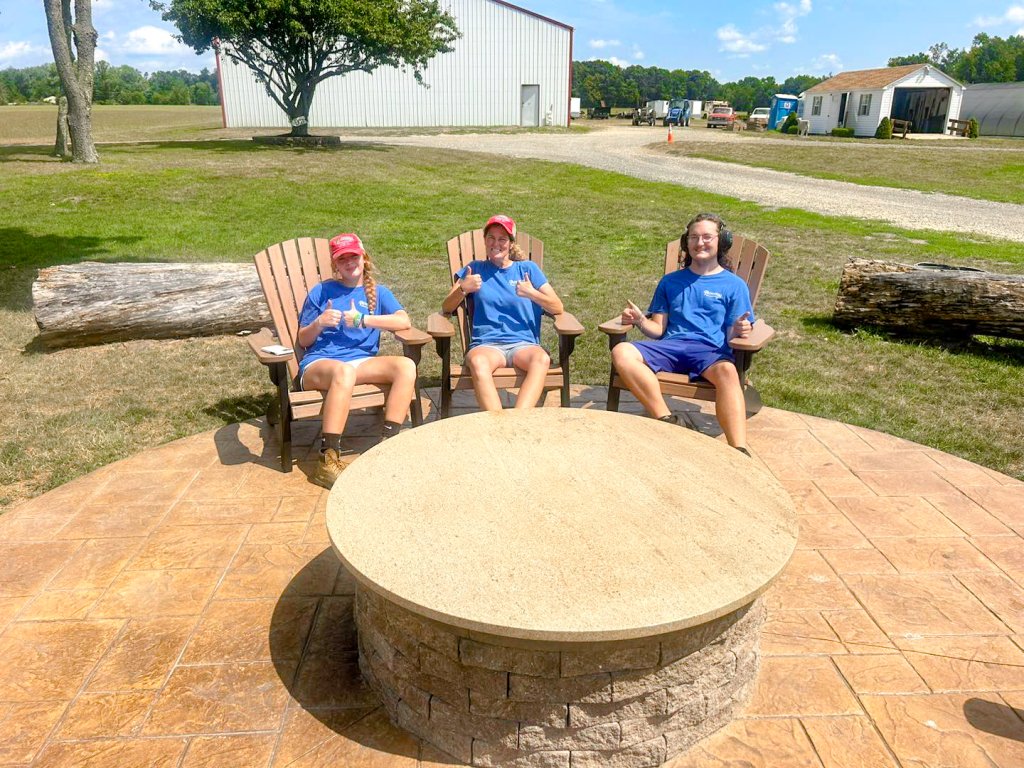 Guests relaxing around the fire pit